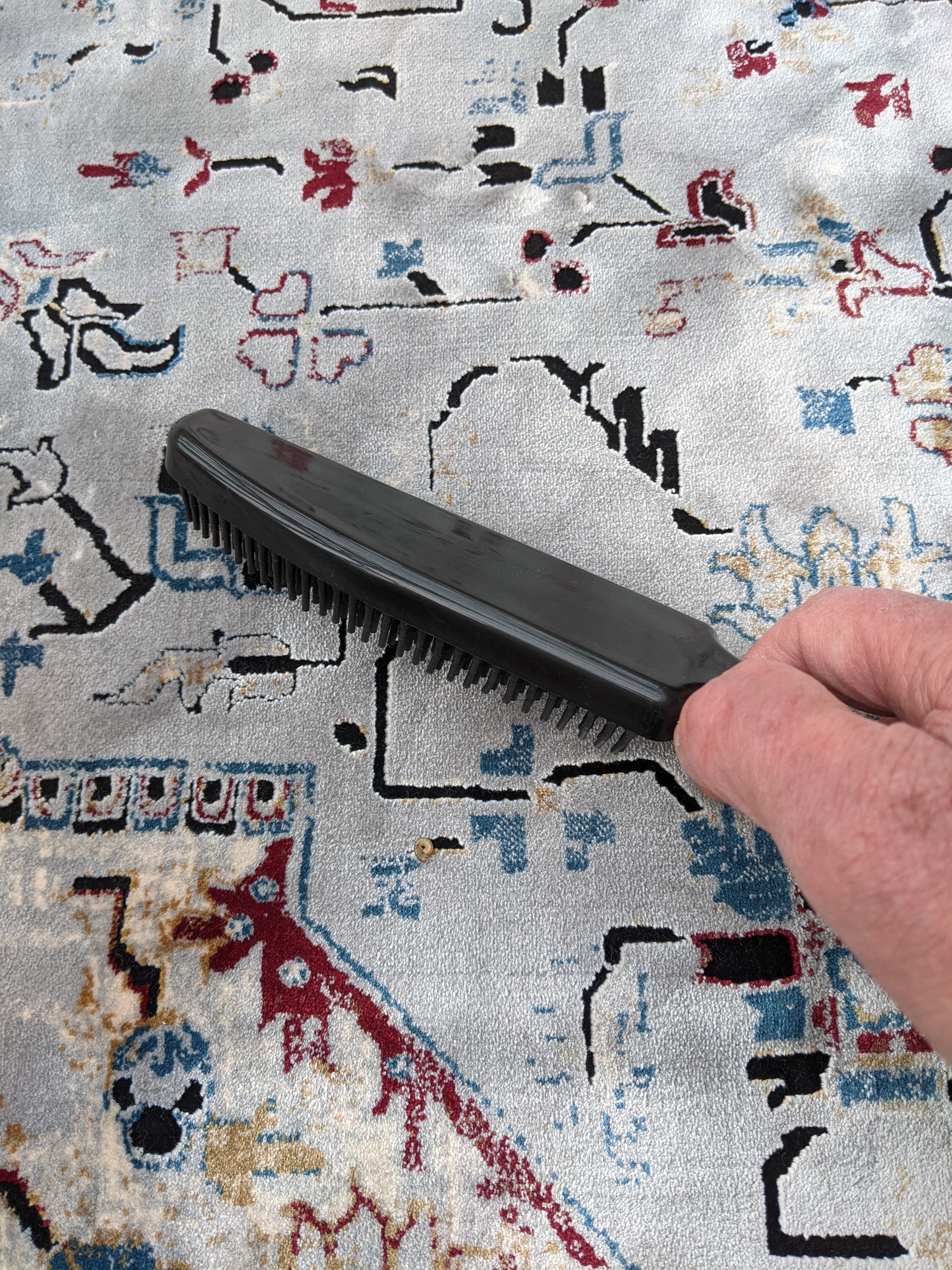 Remove pet hair from rugs with a Berkeley Dog Hair Remover Brsh